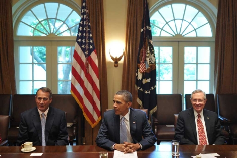 El republicano John Boehner, Obama y el demcrata Harry Reid. | AFP