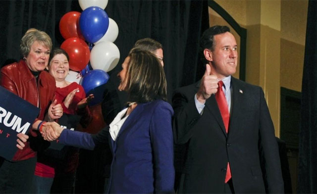Santorum y su esposa celebran los resultados de los caucus anoche en Misuri. | Reuters