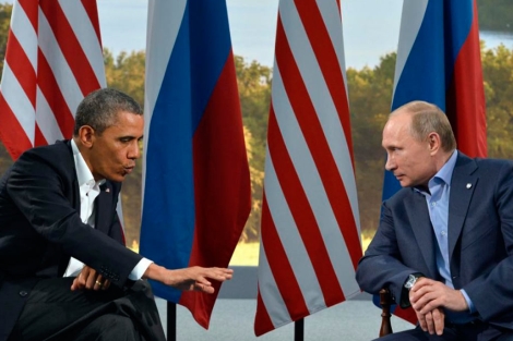 Obama con Putin en la reunión que han mantenido en el G-8. | Afp
