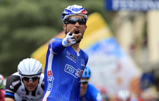 France's Nacer Bouhanni (FDJ.fr) celebrates as he crosses the...