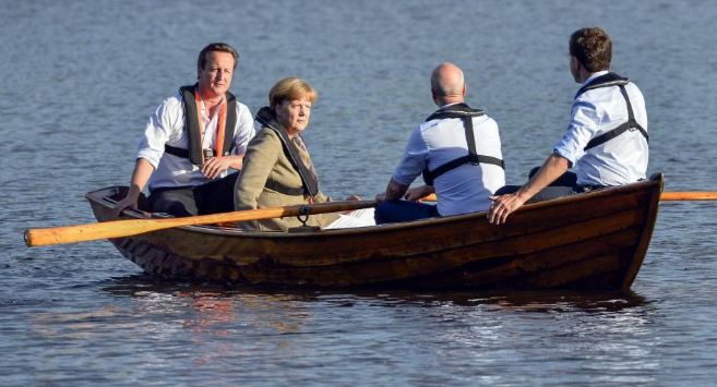 Cameron, Merkel y el premier, Fredrik Reinfeld y su homlogo...