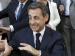 El ex presidente Nicolas Sarkozy abandona la sede del UMP en Pars.