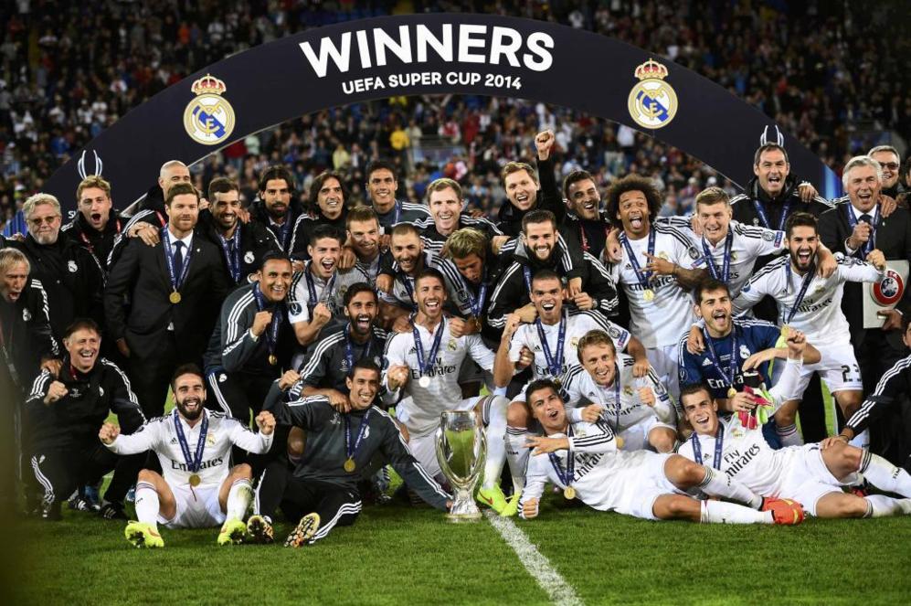 Real Madrid team members pose after winning the UEFA Super Cup final...