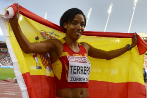 Spain's Indira Terrero, holding her national flag, celebrates...