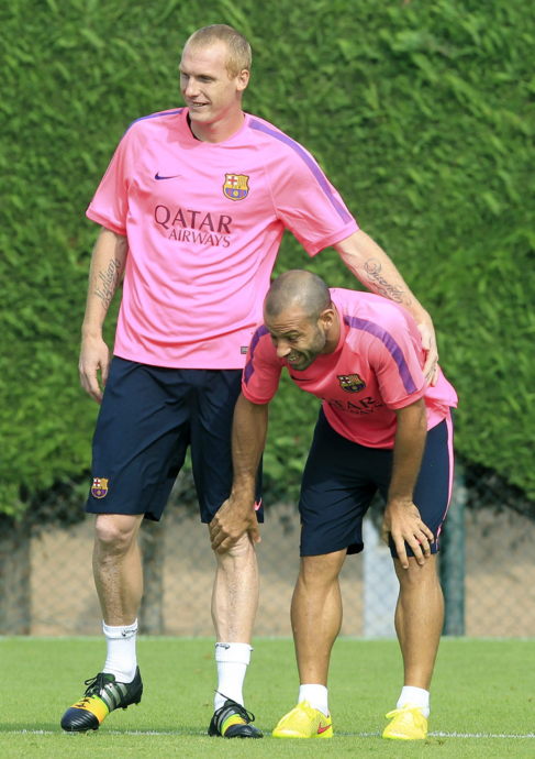 Mathieu y Mascherano, durante un entrenamiento con el Barcelona.