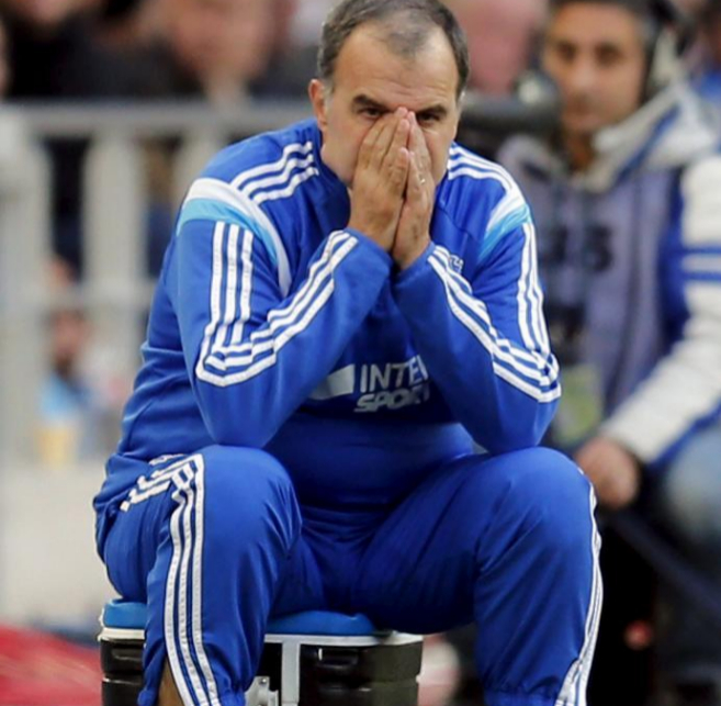 Olympique Marseille's coach Marcelo Bielsa looks at his players...
