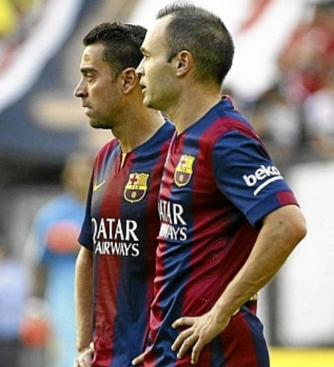 Iniesta y Xavi, durante un partido de esta temporada.