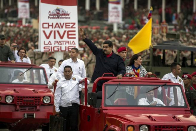 Venezuela's President Nicolas Maduro (C) greets supporters and...