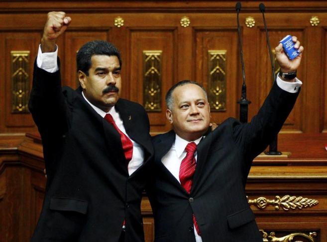 El presidente Nicolas Maduro, junto a Diosdado Cabello, presidente de...
