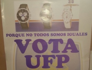 Cartel de la UFP animando a votar y ofreciendo un reloj.