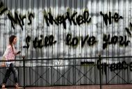 Grafiti en una calle de Atenas sobre Angela Merkel