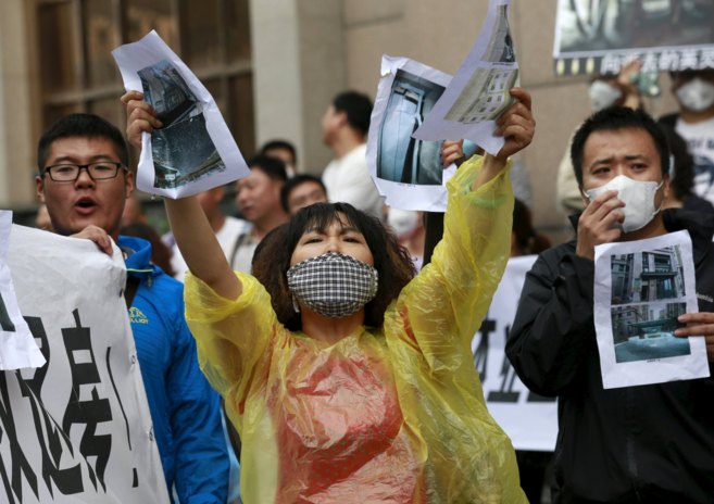 Vctimas de la explosin en Tianjin protestan contra el Gobierno...