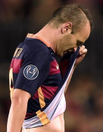 Barcelona&#039;s midfielder Andres Iniesta leaves the field after...