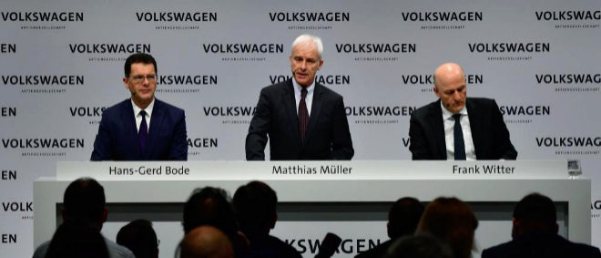 Matthias Mueller (C), CEO of German car maker Volkswagen (VW), is...