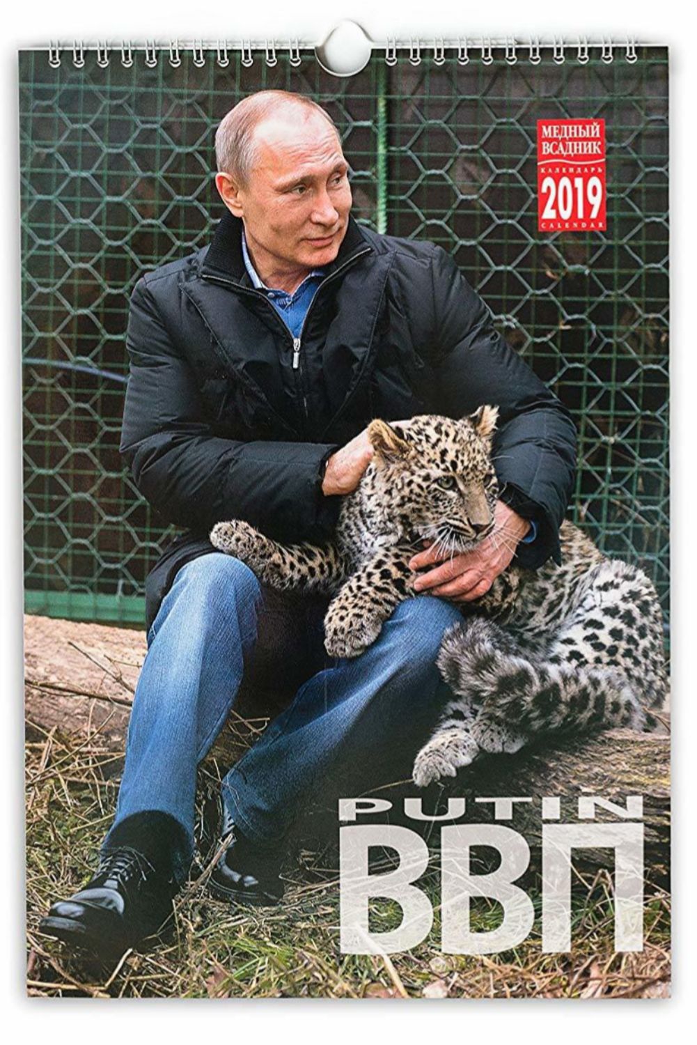 Vladimir Putin acaricia a un cachorro de leopardo en una de las...