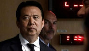 El presidente de Interpol, Meng Hongwei, durante la visita del...