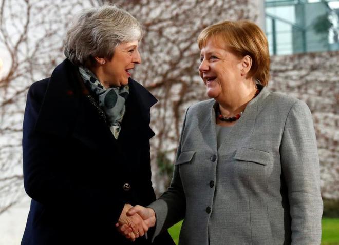 Theresa May y Angela Merkel.