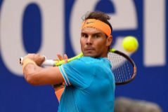 BARCELONA, SPAIN - APRIL 25: Rafael <HIT>Nadal</HIT> of Spain plays a backhand against David Ferrer of Spain during the round of 16 match on day two of the Barcelona Open Banc Sabadell at Real Club De Tenis Barcelona on April 25, 2019 in Barcelona, Spain. (Photo by David Ramos/Getty Images)