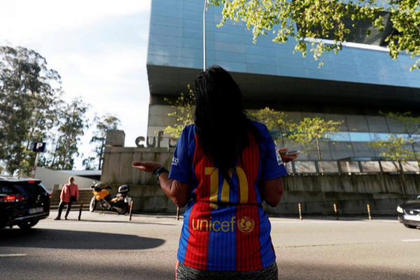 Concecao Alves, supporter of Barcelona, prays outside CUF hospital...