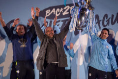 Manchester City's Spanish manager Pep <HIT>Guardiola</HIT> (C), Manchester City assistant coach Mikel Arteta (R) and Manchester City's Belgian defender Vincent Kompany (L) show the Premier League trophy to supporters outside the Etihad Stadium in Manchester, northern England on May 12, 2019. - Manchester City held off a titanic challenge from Liverpool to become the first side in a decade to retain the Premier League on Sunday by coming from behind to beat Brighton 4-1 on Sunday. (Photo by Oli SCARFF / AFP)