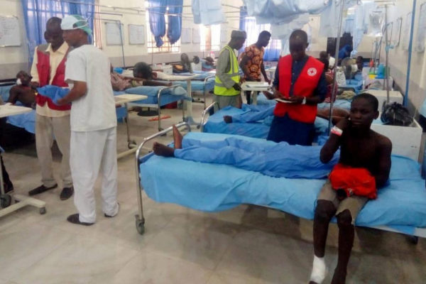 Injured people receive treatment inside a hospital in Maiduguri, after...