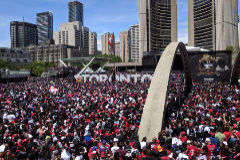 <HIT>Toronto</HIT> fans gather in front of the city hall during the <HIT>Toronto</HIT> Raptors NBA Championship celebration parade at Nathan Phillips Square in <HIT>Toronto</HIT>