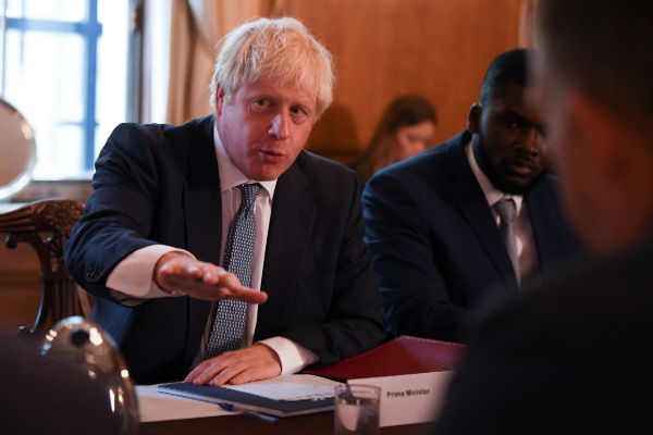 Britain&amp;apos;s Prime Minister <HIT>Boris</HIT> Johnson attends a roundtable...