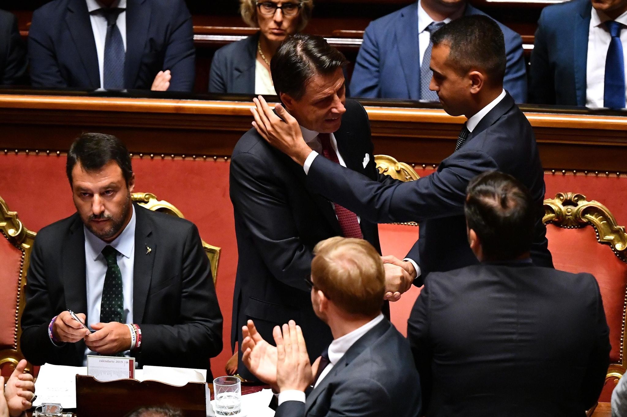 Rome (Italy).- Italian Prime Minister Giuseppe Conte (C) is hugged by...