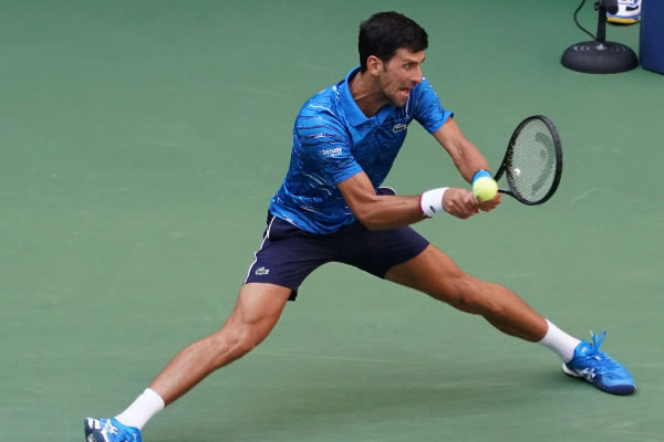 Novak <HIT>Djokovic</HIT> of Serbia warms up before playing against...
