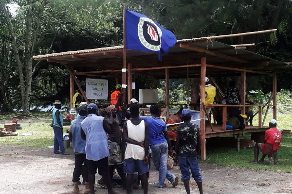 FILE PHOTO: Residents hold a <HIT>Bougainville</HIT> flag at a polling...