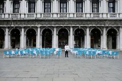 A waiter stands by empty tables outside a restaurant at St Mark's Square, which is usually full of tourists, after Italy's government adopted a decree with emergency new measures to contain the lt;HIT gt;coronavirus lt;/HIT gt;, in Venice