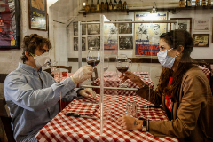 Rome (Italy).- Valerio Calderoni, owner of an italian tipical restaurant, and his wife Martina, pose for a picture during a test for a of possible plexiglass separator between tables of restaurant ''Il Ciak'', Trastevere district in Rome, Italy, 23 April 2020. Countries around the world are taking measures to stem the widespread of the SARS-CoV-2 coronavirus which causes the Covid-19 disease. ( lt;HIT gt;Italia lt;/HIT gt;, Roma) EPA/