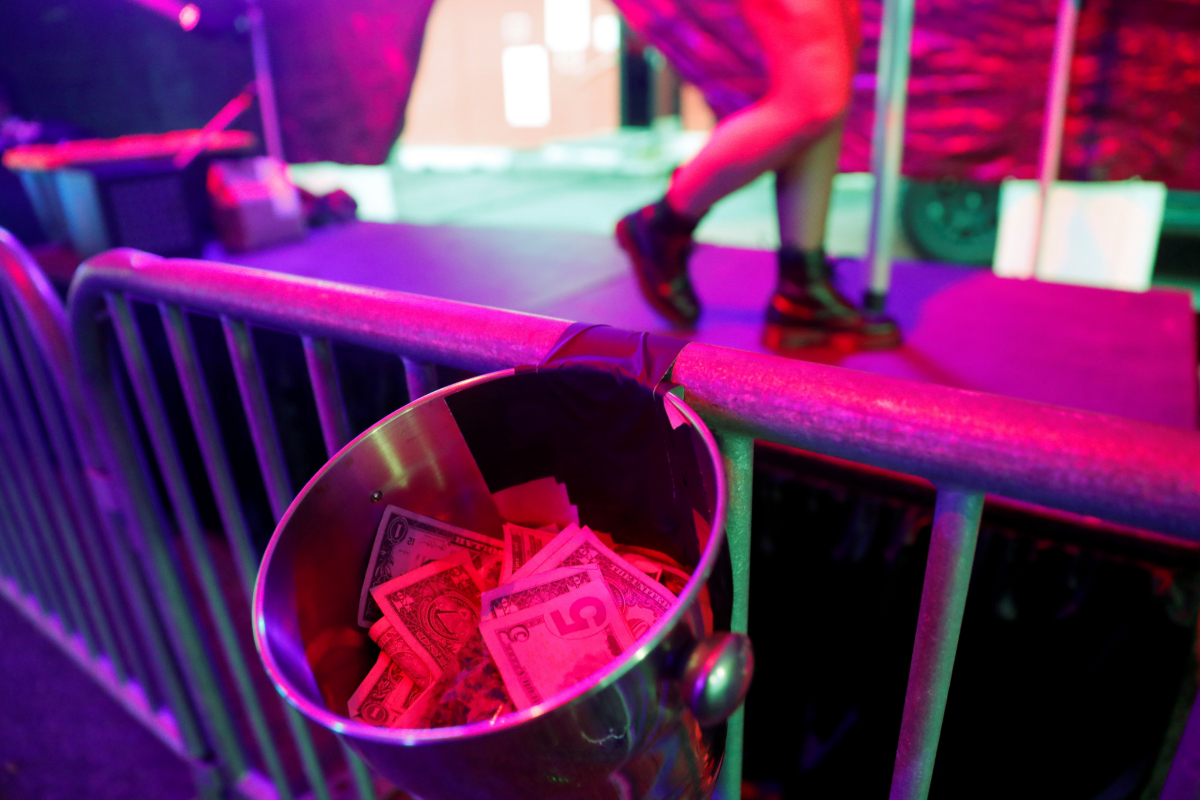 Tips are seen in a drive-through go-go dance tent at the Lucky Devil Lounge strip club in Portland