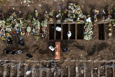 TOPSHOT - Aerial view showing a burial of a victim of COVID-19 at the General Cemetery in Santiago June 15, 2020 amid the novel coronavirus pandemic