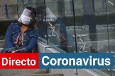 Una mujer con mascarilla y pantalla para el coronavirus.