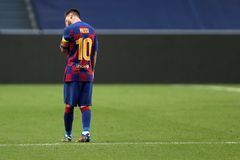 TOPSHOT - Barcelona's Argentinian forward Lionel lt;HIT gt;Messi lt;/HIT gt; reacts after Bayern Munich's second goal during the UEFA Champions League quarter-final football match between Barcelona and Bayern Munich at the Luz stadium in Lisbon on August 14, 2020. (Photo by Manu Fernandez / POOL / AFP)