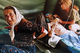 A picture taken on July 11, 1995 shows an elderly lt;HIT gt;Muslim lt;/HIT gt; lt;HIT gt;woman lt;/HIT gt; and her husband getting treatment for injuries inflicted on them by Serb military forces as they fled the east Bosnian enclave of Srebrenica. A Bosnian court on June 15, 2012 convicted four former elite soldiers of crimes against humanity for executing some 800 Bosnian Muslims during the 1995 Srebrenica massacre and sentenced them to up to 43 years. (The man on the right died shortly after the picture was taken). AFP PHOTO/Odd ANDERSEN (Photo by ODD ANDERSEN / AFP) PARA PAPEL CULTURA PABLO