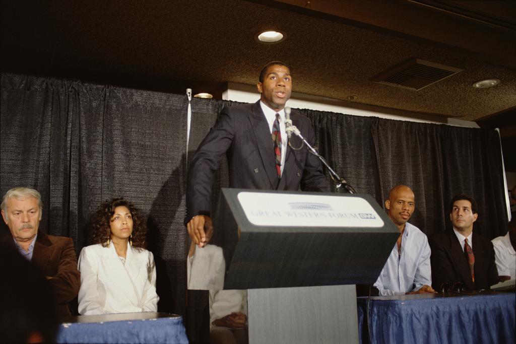 Johnson, el 7 de noviembre de 1991, junto a su mujer y Abdul-Jabbar.