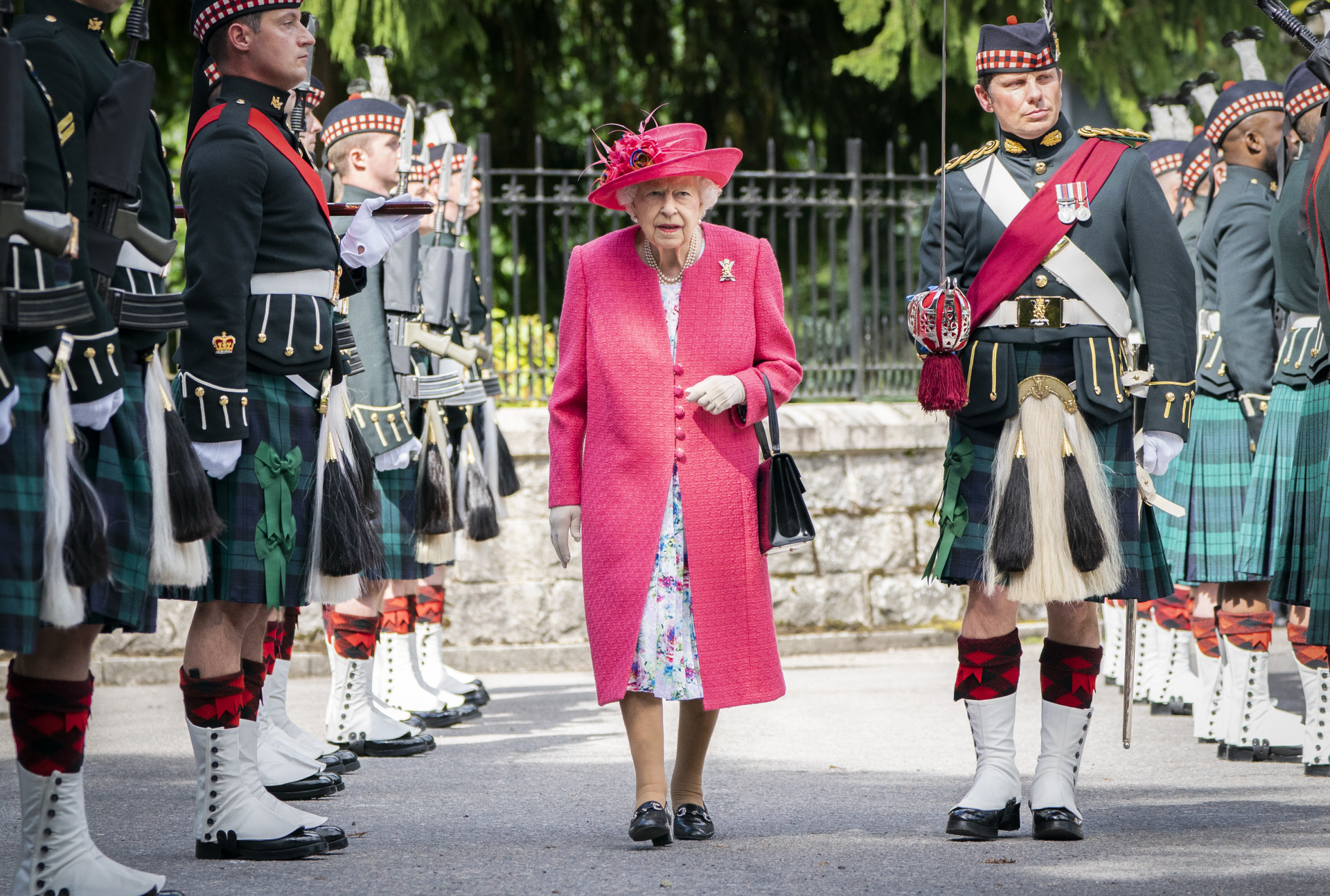 Queen Elizabeth II reviews army
