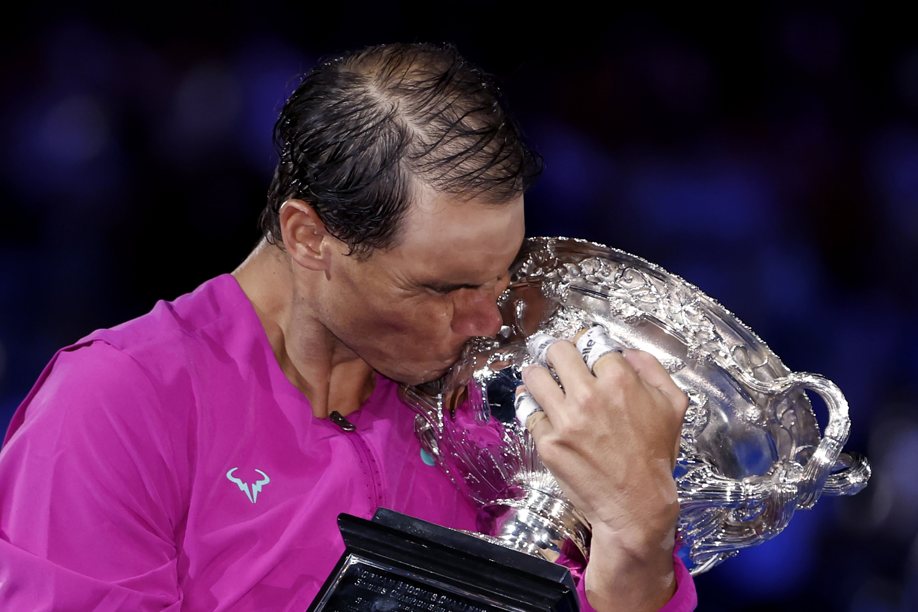 Rafael  lt;HIT gt;Nadal lt;/HIT gt; of Spain kisses the Norman Brookes Challenge Cup after defeating Daniil Medvedev of Russia in during the men's singles final at the Australian Open tennis championships in Melbourne, Australia, early Monday, Jan. 31, 2022. (AP Photo/Hamish Blair)