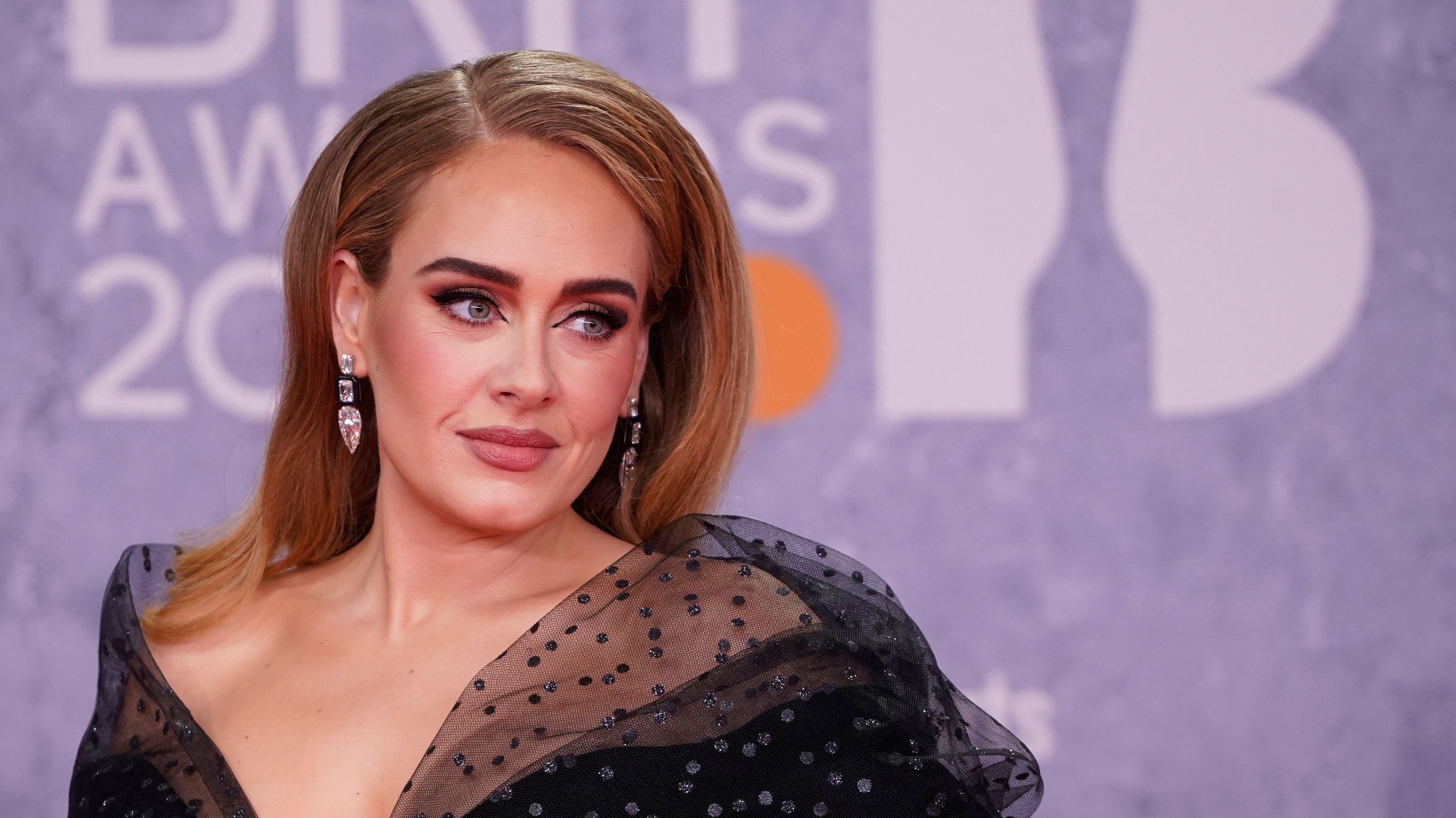 British singer  lt;HIT gt;Adele lt;/HIT gt; Laurie Blue Adkins aka  lt;HIT gt;Adele lt;/HIT gt; poses on the red carpet upon her arrival for the BRIT Awards 2022 in London on February 8, 2022. (Photo by Niklas HALLE'N / AFP) / RESTRICTED TO EDITORIAL USE - NO POSTERS - NO MERCHANDISE- NO USE IN PUBLICATIONS DEVOTED TO ARTISTS
