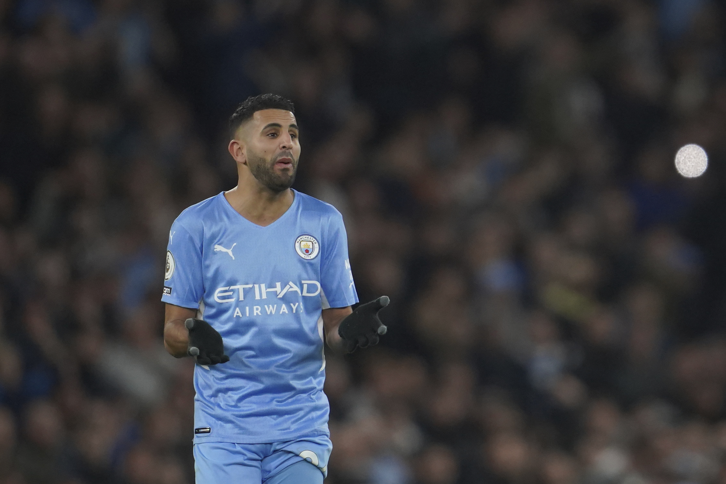Manchester City's Riyad  lt;HIT gt;Mahrez lt;/HIT gt; gestures during the English Premier League soccer match between Manchester City and Manchester United, at the Etihad stadium in Manchester, England, Sunday, March 6, 2022. (AP Photo/Jon Super)