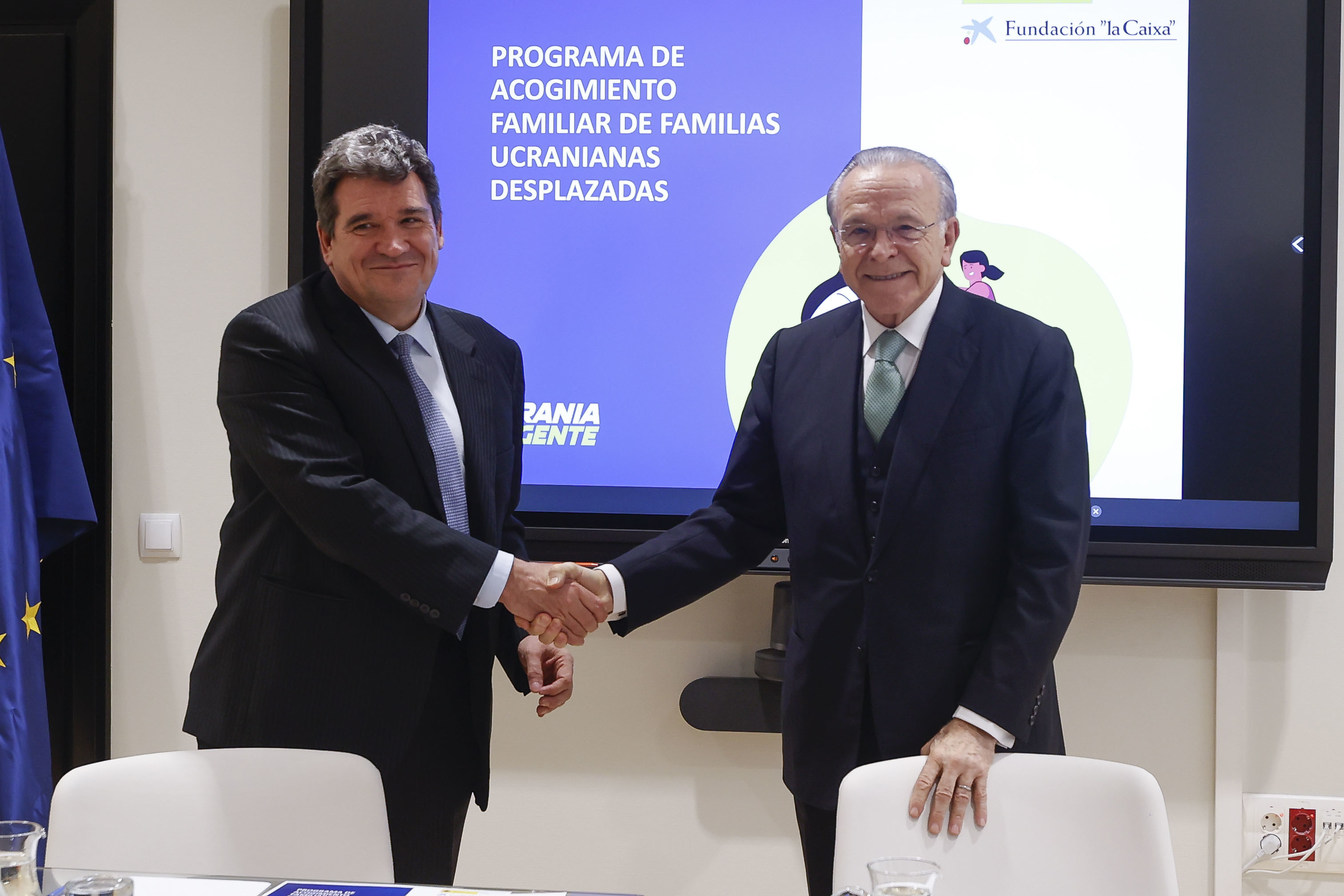 El ministro de Inclusión, Seguridad Social y Migraciones, José Luis Escrivá, y el presidente de la Fundación 'La Caixa', Isidro Fainé