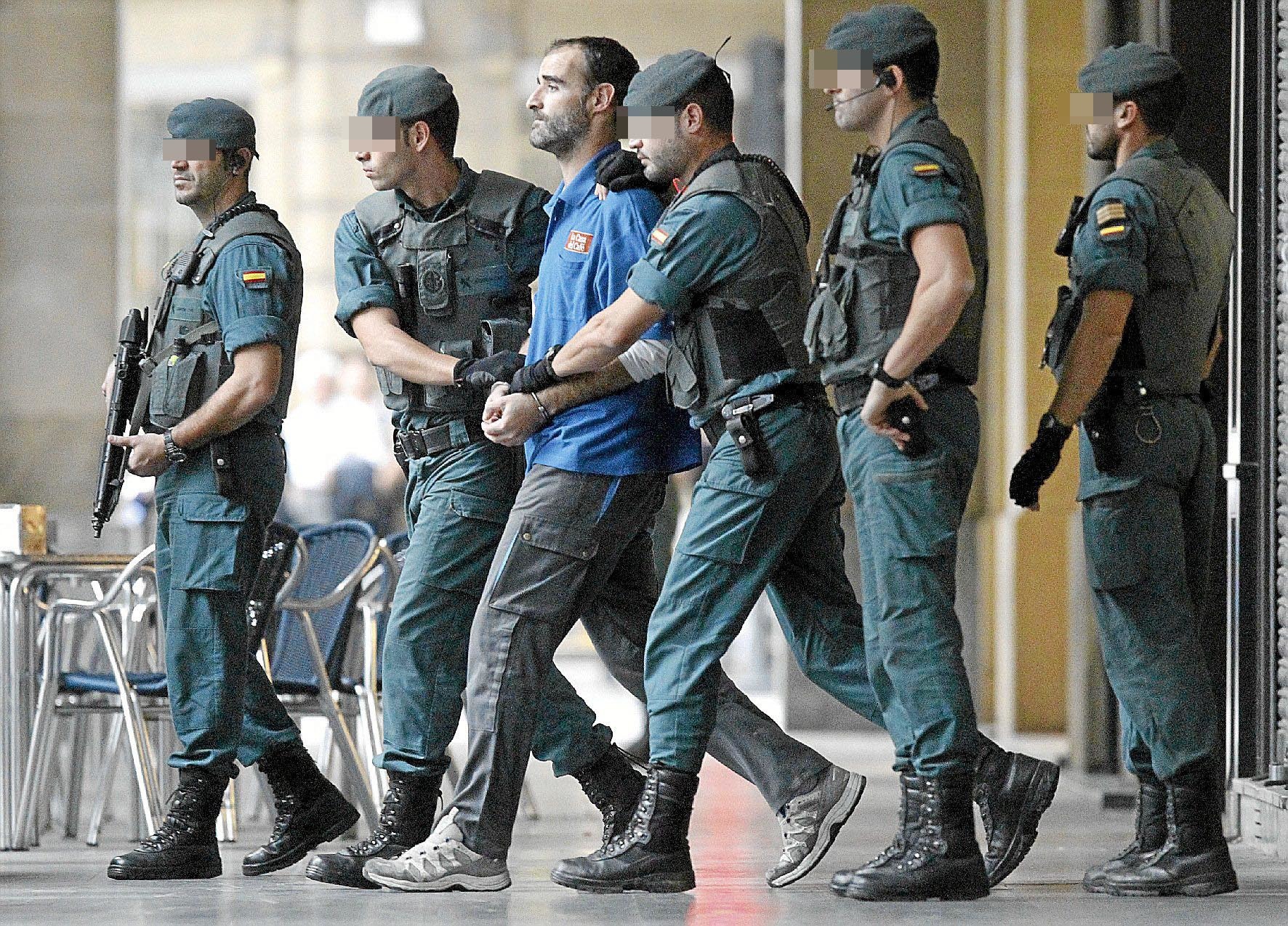 The Civil Guard leads ETA member Javier Etristan for a search in San Sebastique in 2010