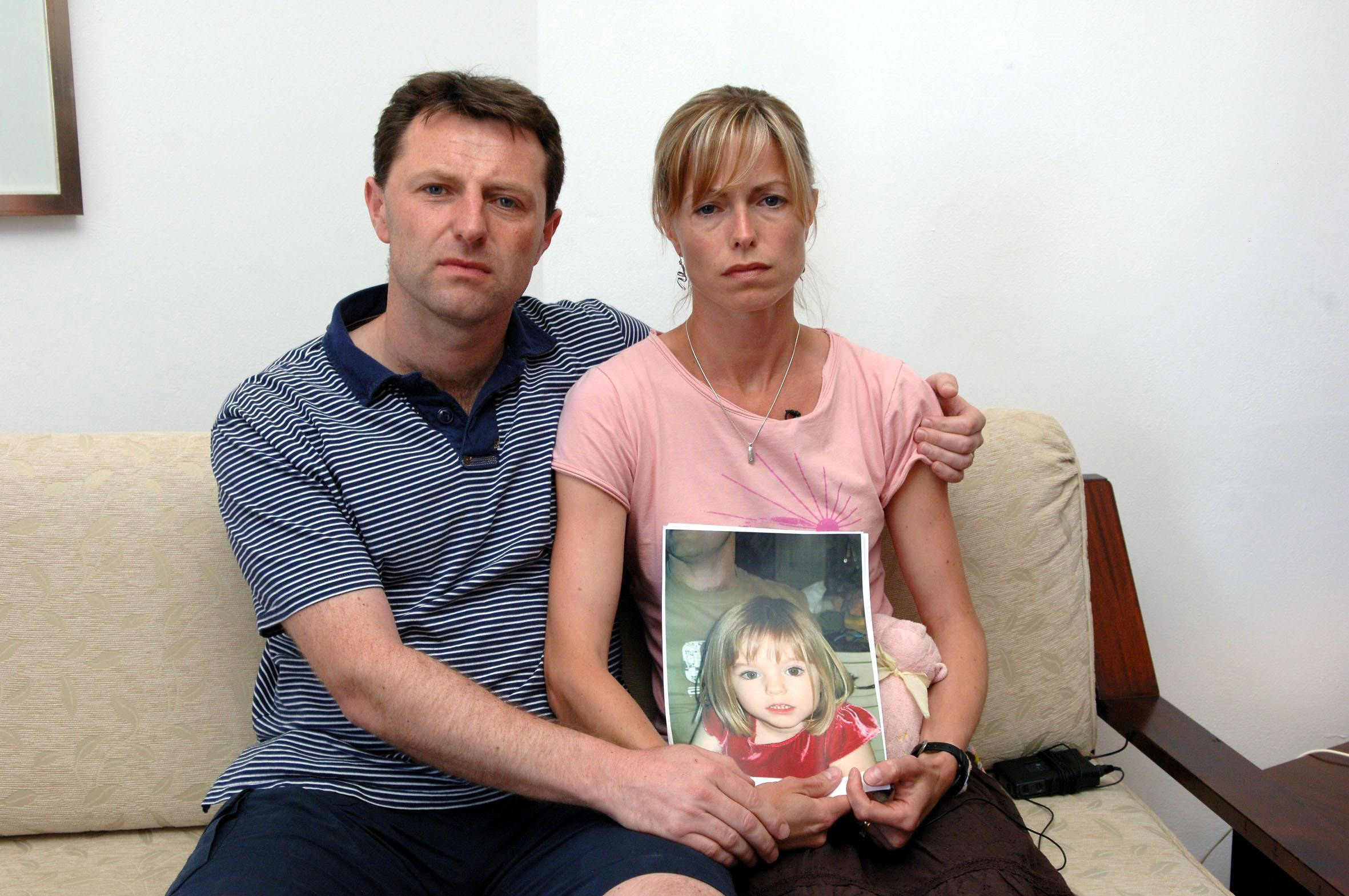 Kate and Gerry McCann with a picture of their daughter in 2007.