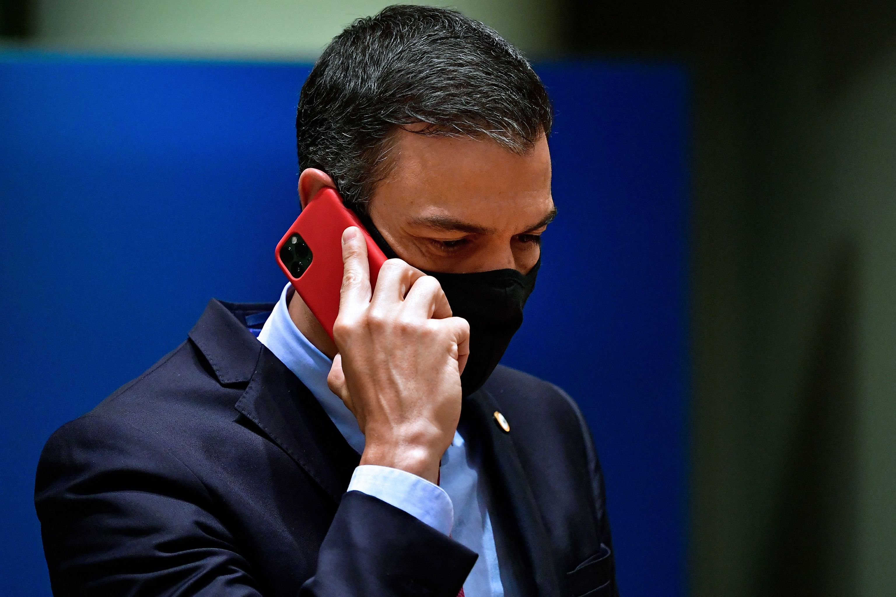 (FILES) In this file photo taken on July 20, 2020 Spain's Prime Minister  lt;HIT gt;Pedro lt;/HIT gt;  lt;HIT gt;Sanchez lt;/HIT gt; phones during an EU summit in Brussels. - Spain said on May 2, 2022 that the mobile phones of Prime Minister  lt;HIT gt;Pedro lt;/HIT gt;  lt;HIT gt;Sanchez lt;/HIT gt; and Defence Minister Margarita Robles were tapped using Pegasus spyware in an "illicit and external" intervention. (Photo by JOHN THYS / POOL / AFP)