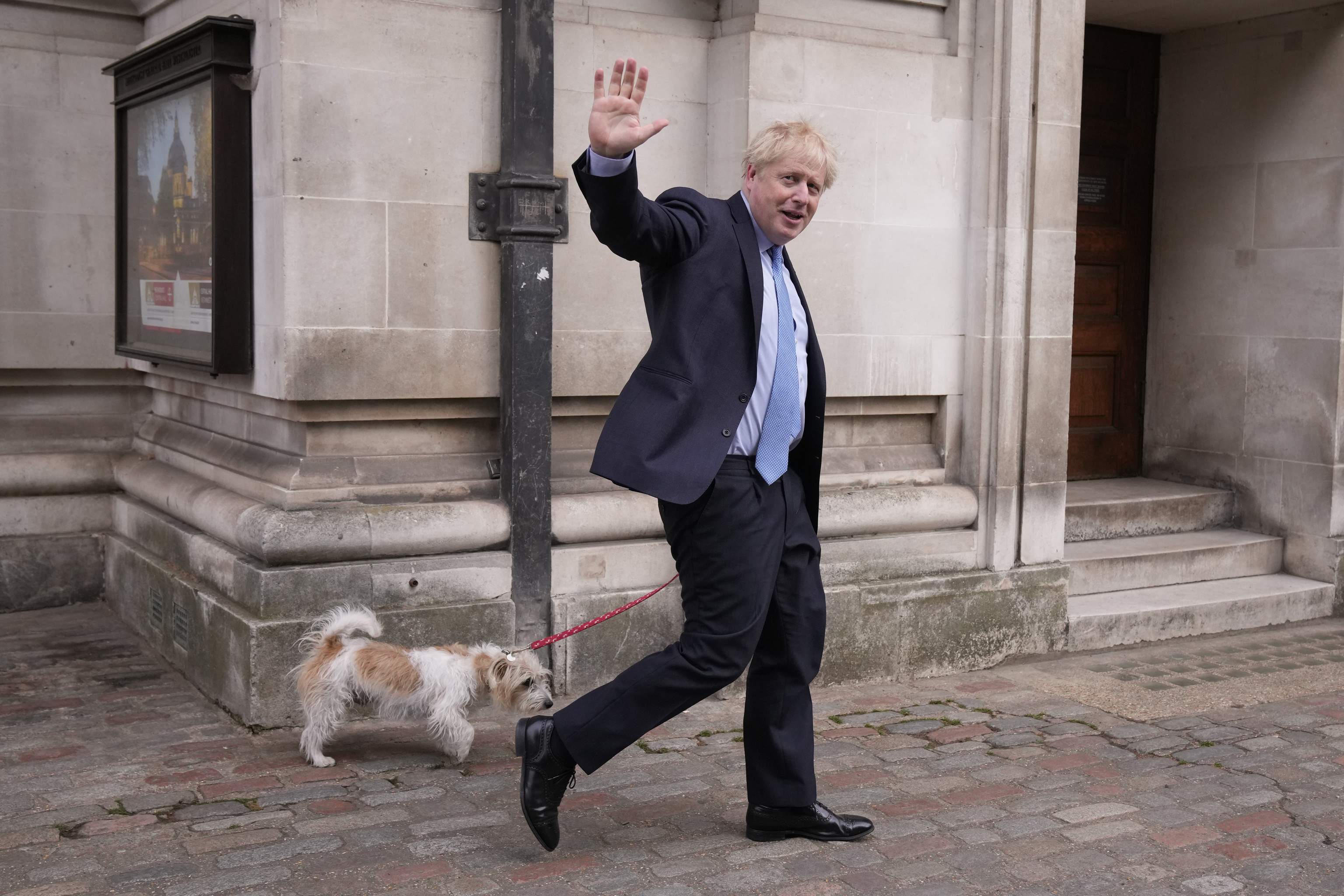 'Premier' Boris Johnson greets the press in London yesterday after the vote.