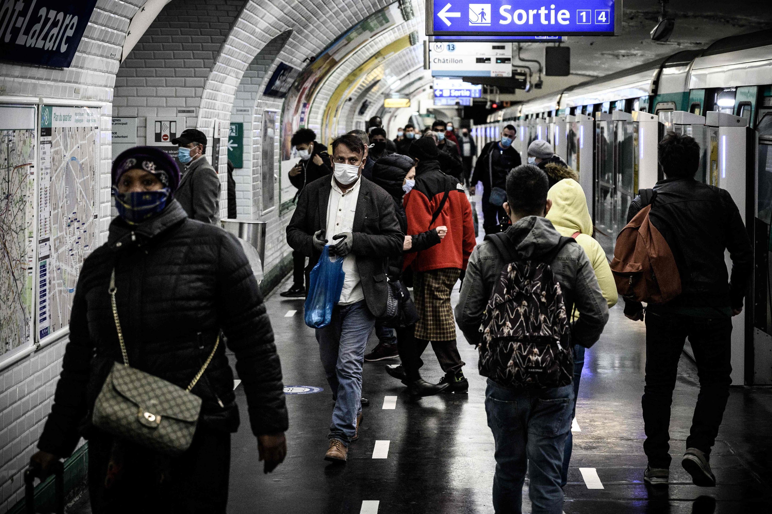 Passengers wearing face masks in metro.