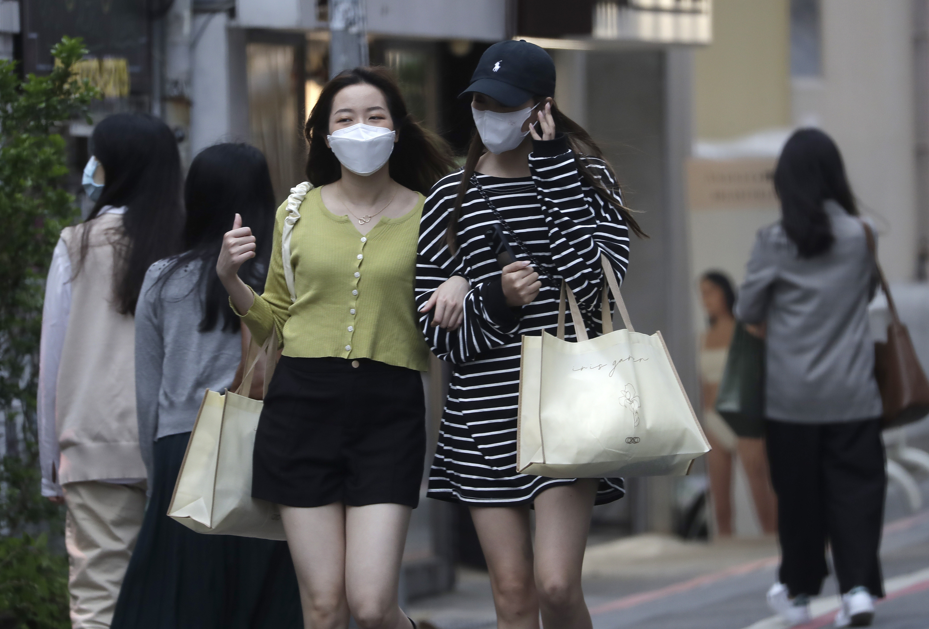 Women walking on the street in Taipei, Taiwei
