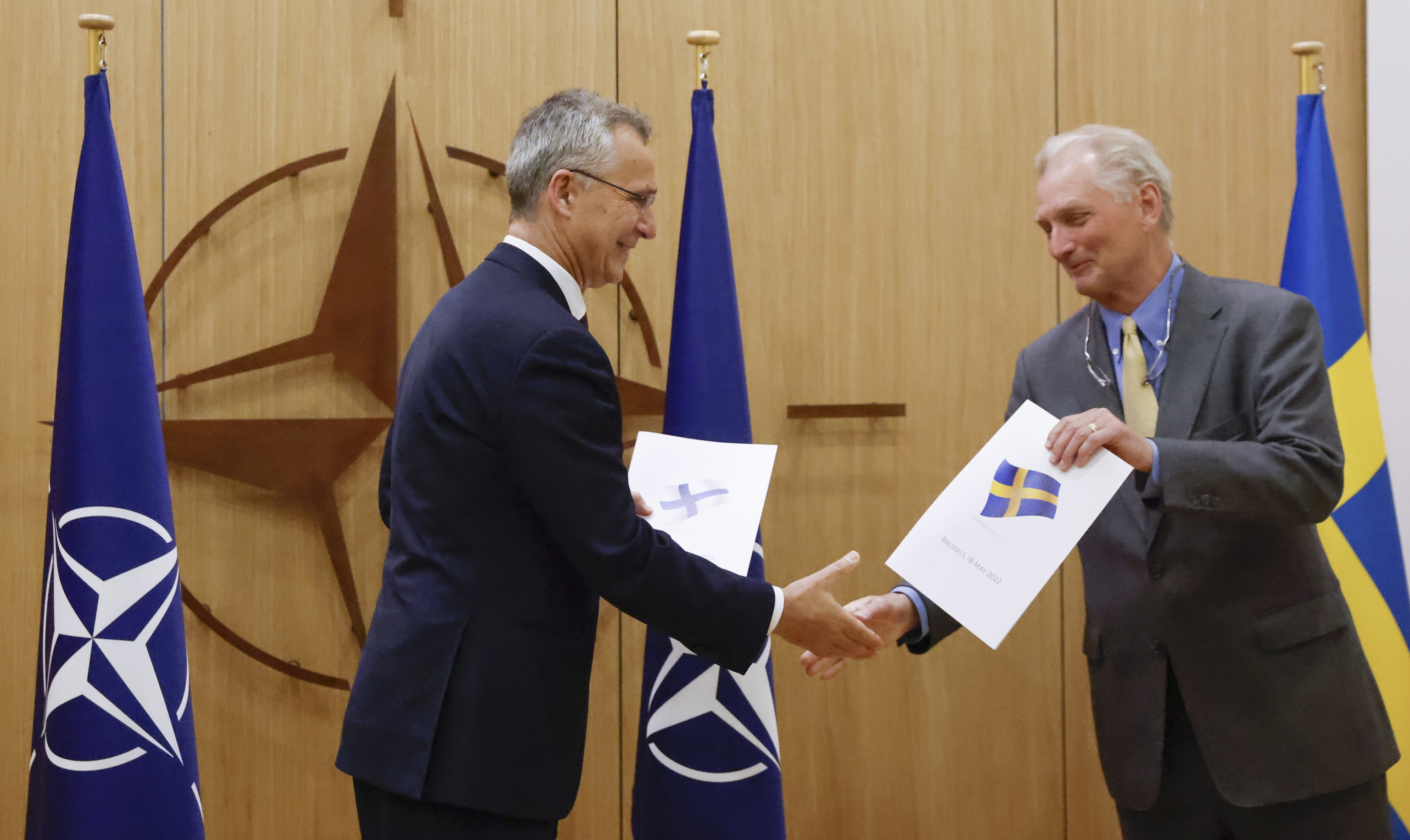 The Swedish ambassador delivers the NATO entry in Brussels.